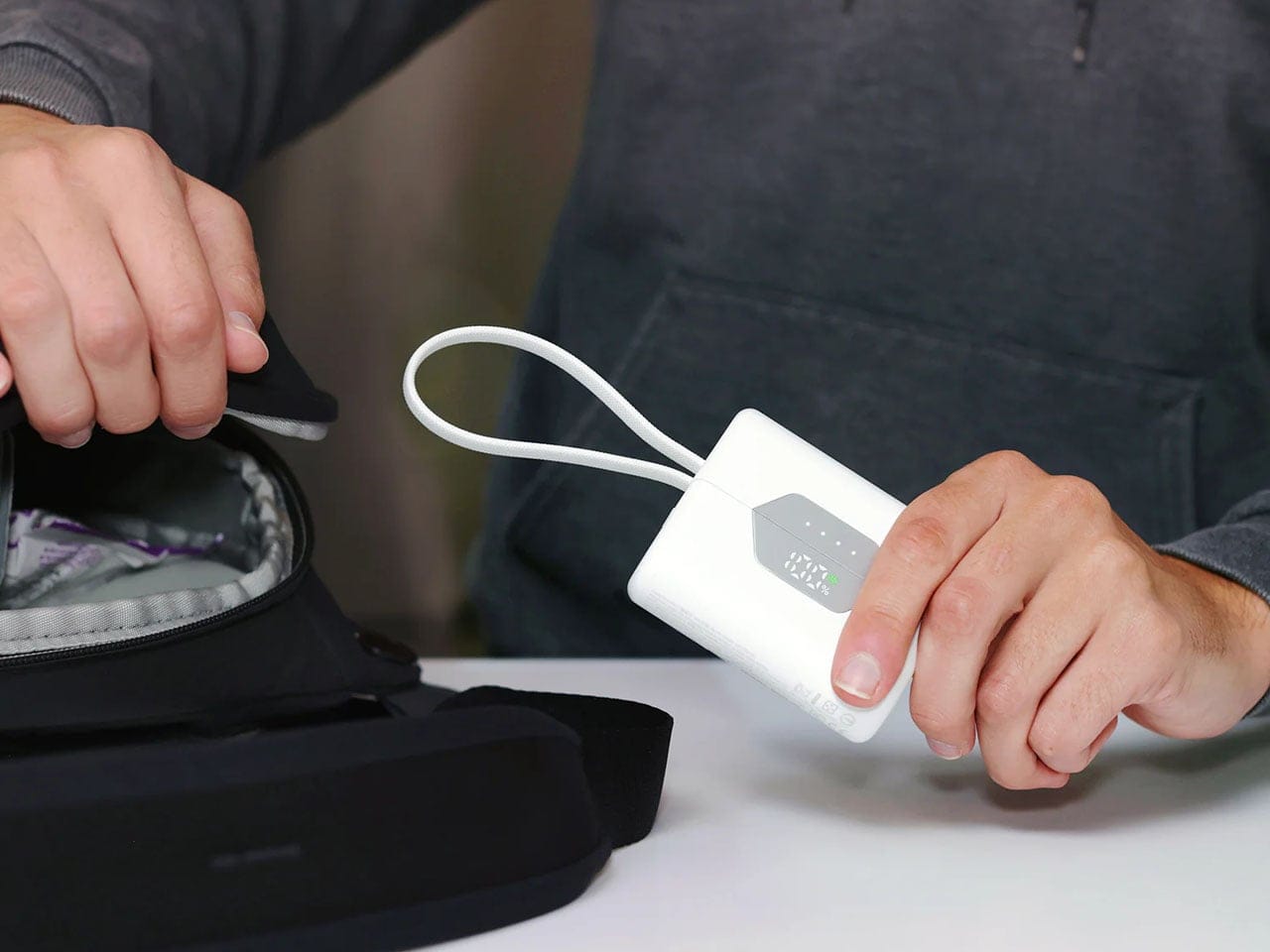 Nimble SharePower white edition with braided lanyard being used as a USB-C cable